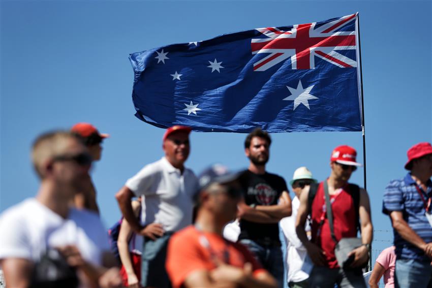 Melbourne main straight F1 fans and flag