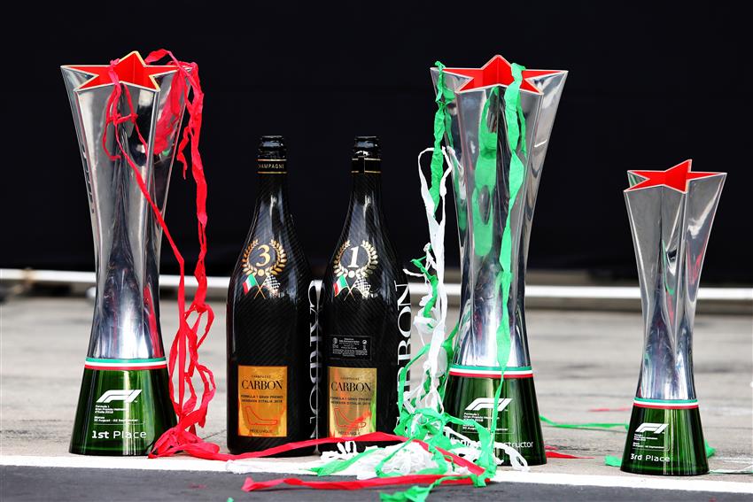 Three F1 trophy's and champagne