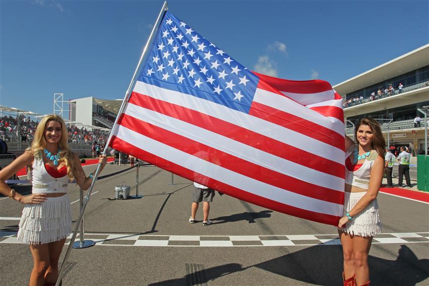 F1 Cowgirls holding USA flag