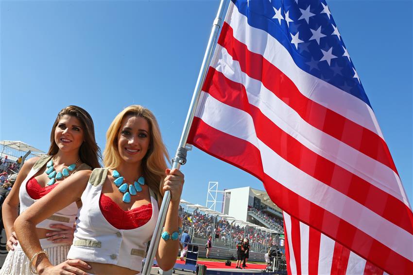 F1 Cowgirls holding USA flag