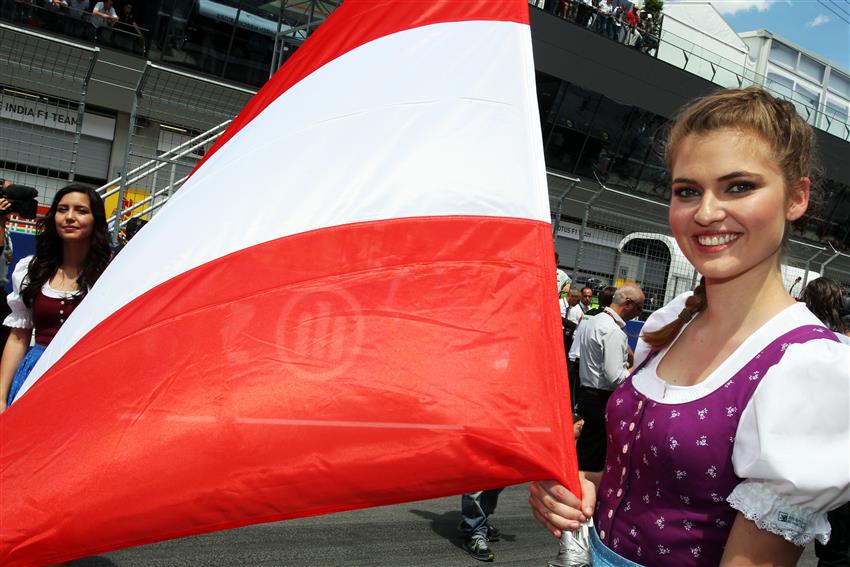 Close up of grid girl and Austrian flag