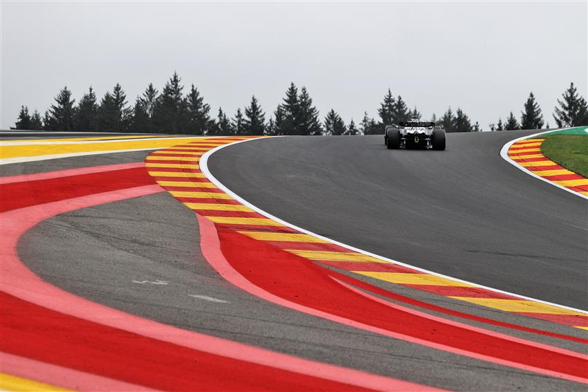 F1 speeding car on colourful asphalt