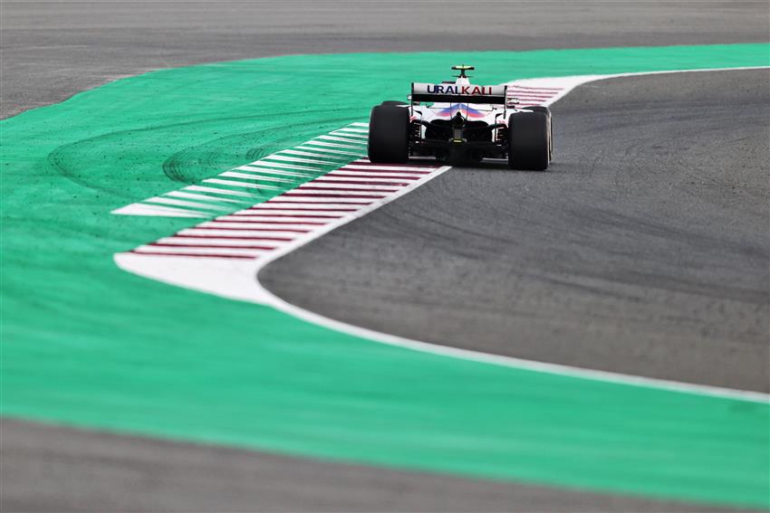 F1 race car on green asphalt