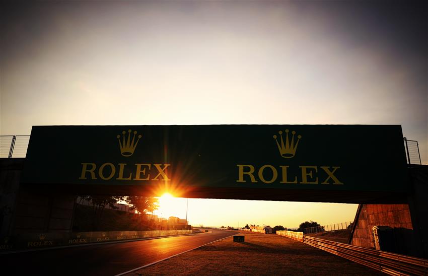 sunset and Rolex sign