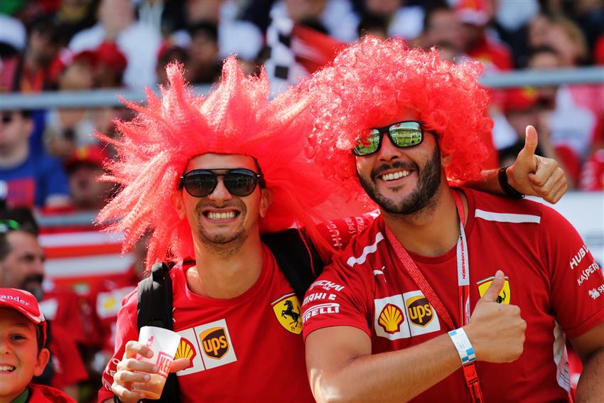 F1 fans in big red wigs