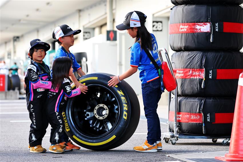 children playing with F1 tyre
