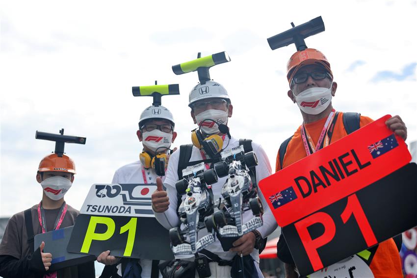 four f1 fans in hats