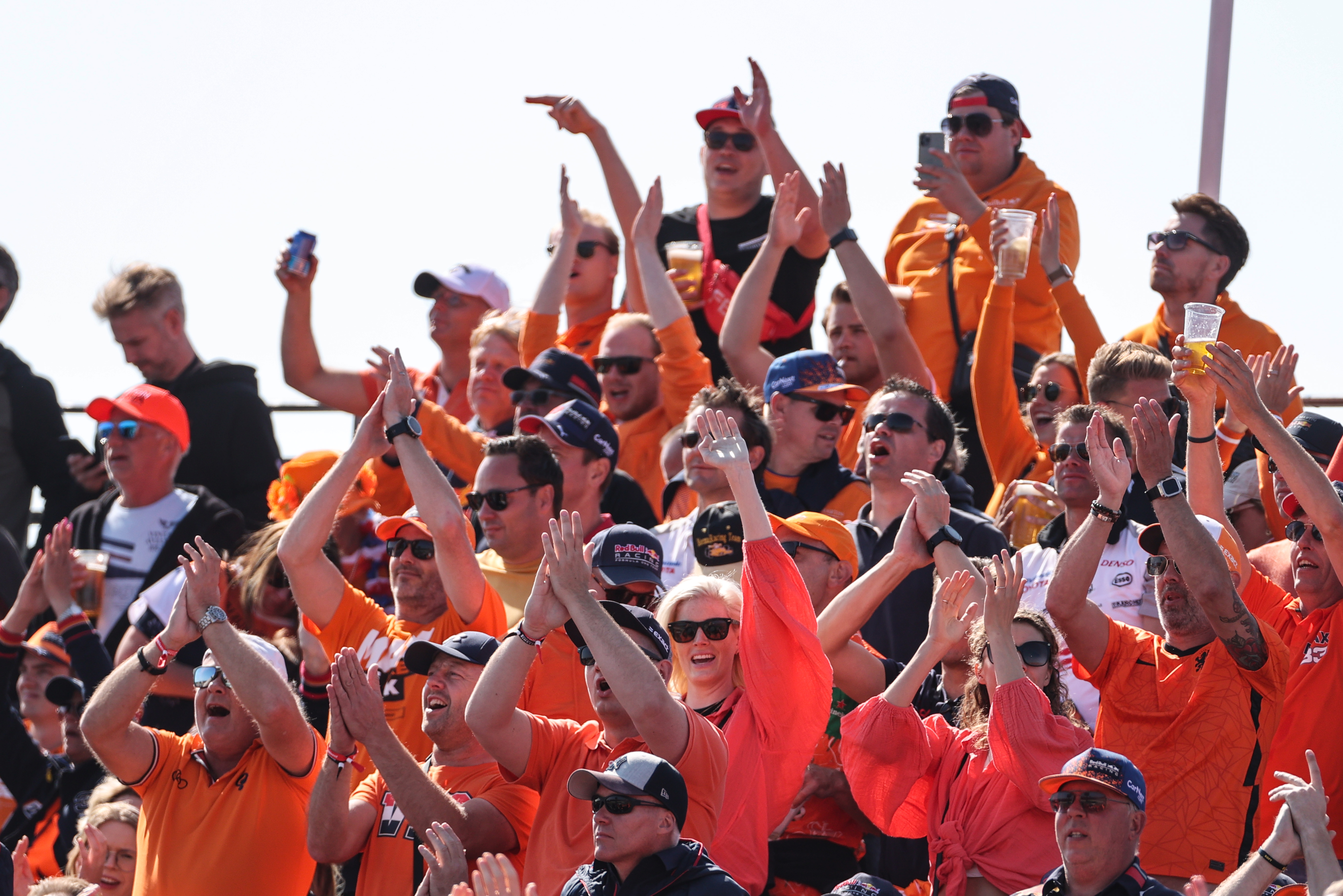 Race fans waving